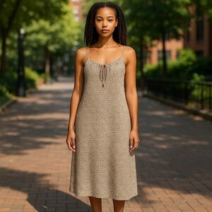 Tan spaghetti strap dress with a split